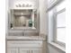 Bathroom with single vanity and granite countertop at 4880 Sw 106Th St, Ocala, FL 34476