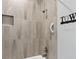 Shower stall with gray tile and handheld shower head at 4880 Sw 106Th St, Ocala, FL 34476