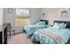 Bedroom with two twin beds and window at 4880 Sw 106Th St, Ocala, FL 34476