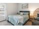 Guest bedroom with a queen bed and window at 4880 Sw 106Th St, Ocala, FL 34476