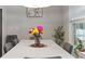 Bright dining room features a large table with seating for six at 4880 Sw 106Th St, Ocala, FL 34476