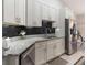 Modern kitchen with stainless steel appliances and granite countertops at 4880 Sw 106Th St, Ocala, FL 34476