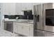 Modern kitchen with stainless steel appliances and granite countertops at 4880 Sw 106Th St, Ocala, FL 34476