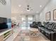 Spacious living room with a view of the pool and comfortable seating at 4880 Sw 106Th St, Ocala, FL 34476