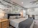 Main bedroom with king bed and accent wall at 4880 Sw 106Th St, Ocala, FL 34476
