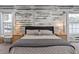 Main bedroom with king bed and accent wall at 4880 Sw 106Th St, Ocala, FL 34476