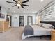 Main bedroom with king bed and ceiling fan at 4880 Sw 106Th St, Ocala, FL 34476