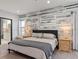 Main bedroom with king bed and en-suite bathroom at 4880 Sw 106Th St, Ocala, FL 34476