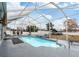 Screened-in pool with waterfall feature at 4880 Sw 106Th St, Ocala, FL 34476