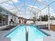 Screened-in pool with waterfall feature at 4880 Sw 106Th St, Ocala, FL 34476