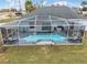 Inviting screened-in pool area, perfect for enjoying sunny days and outdoor living at 4880 Sw 106Th St, Ocala, FL 34476