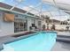 Screened-in pool with patio furniture at 4880 Sw 106Th St, Ocala, FL 34476