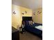 Bright bedroom featuring a double bed and wall art at 52 Pine Trak # G 104, Ocala, FL 34472