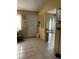 Bright entryway with tiled floors and a view to the kitchen at 52 Pine Trak # G 104, Ocala, FL 34472