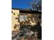 Tan stucco exterior with a walkway, bicycle, and tree at 52 Pine Trak # G 104, Ocala, FL 34472