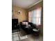 Cozy living room with black couch and side table at 52 Pine Trak # G 104, Ocala, FL 34472