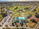Community clubhouse with pool, tennis courts, and parking at 5908 Nw 24Th St, Ocala, FL 34482