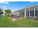 Relaxing patio with seating area, grill, and lush landscaping at 5908 Nw 24Th St, Ocala, FL 34482