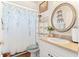Bathroom with shower, toilet, vanity, and decorative accents at 5908 Nw 24Th St, Ocala, FL 34482