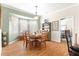 Bright dining area with a wooden table and built-in hutch at 5908 Nw 24Th St, Ocala, FL 34482