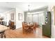 Charming dining room with a round wooden table and bay window at 5908 Nw 24Th St, Ocala, FL 34482