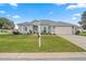 Well-maintained house with a lush lawn and attractive curb appeal at 5908 Nw 24Th St, Ocala, FL 34482