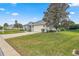 Single-story home with a landscaped yard and attached garage at 5908 Nw 24Th St, Ocala, FL 34482