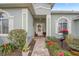 Inviting front entrance with a brick walkway and colorful landscaping at 5908 Nw 24Th St, Ocala, FL 34482