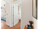 Hallway with hardwood floors and access to bathroom and bedroom at 5908 Nw 24Th St, Ocala, FL 34482