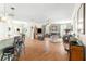 Open concept kitchen with a breakfast bar and hardwood floors at 5908 Nw 24Th St, Ocala, FL 34482