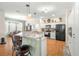 Modern kitchen featuring granite countertops and stainless steel appliances at 5908 Nw 24Th St, Ocala, FL 34482