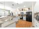 Spacious kitchen with white cabinets, granite countertops, and stainless steel appliances at 5908 Nw 24Th St, Ocala, FL 34482