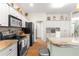 Well-equipped kitchen featuring granite countertops and black appliances at 5908 Nw 24Th St, Ocala, FL 34482