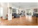 Open living room with hardwood floors and access to the kitchen at 5908 Nw 24Th St, Ocala, FL 34482
