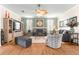 Spacious living room featuring hardwood floors and comfortable seating at 5908 Nw 24Th St, Ocala, FL 34482
