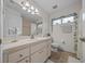 Clean bathroom featuring vanity, toilet, decorative ivy and shower-tub combination at 6009 Sw 107Th St, Ocala, FL 34476