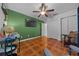 Bedroom features desk, chair, mounted TV and closet space at 6009 Sw 107Th St, Ocala, FL 34476