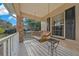 View of a porch swing on the covered front porch, perfect for relaxing outdoors at 6009 Sw 107Th St, Ocala, FL 34476