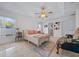 Spacious main bedroom with ceiling fan, neutral walls and tile flooring at 6009 Sw 107Th St, Ocala, FL 34476