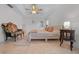 Bright main bedroom with a ceiling fan, neutral walls, and tile flooring at 6009 Sw 107Th St, Ocala, FL 34476