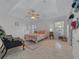 Spacious main bedroom with a ceiling fan, neutral walls, and tile flooring at 6009 Sw 107Th St, Ocala, FL 34476