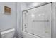 Clean bathroom with a shower/tub combo and white tile at 6458 Sw 89Th Loop, Ocala, FL 34476