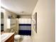 Bathroom featuring tiled floors, shower with curtain, and vanity with sink at 6701 Se 99Th Pl, Belleview, FL 34420