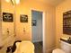 Charming bathroom with a pedestal sink and decorative signs at 6701 Se 99Th Pl, Belleview, FL 34420
