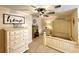 Bedroom features a rustic farmhouse style decor, white furniture, and cozy ambiance at 6701 Se 99Th Pl, Belleview, FL 34420