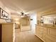 Large bedroom with farmhouse decor, dresser, mirror, and ceiling fan at 6701 Se 99Th Pl, Belleview, FL 34420