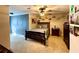 Stylish bedroom with blue accent wall and a bed decorated with striped linens at 6701 Se 99Th Pl, Belleview, FL 34420