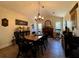 Charming dining room with a fireplace, a rocking chair, and plenty of natural light at 6701 Se 99Th Pl, Belleview, FL 34420
