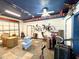 Spacious garage interior featuring epoxy flooring, track lighting, and ample storage space at 6701 Se 99Th Pl, Belleview, FL 34420