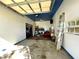 Spacious garage with blue ceilings and ample storage space for tools and equipment at 6701 Se 99Th Pl, Belleview, FL 34420